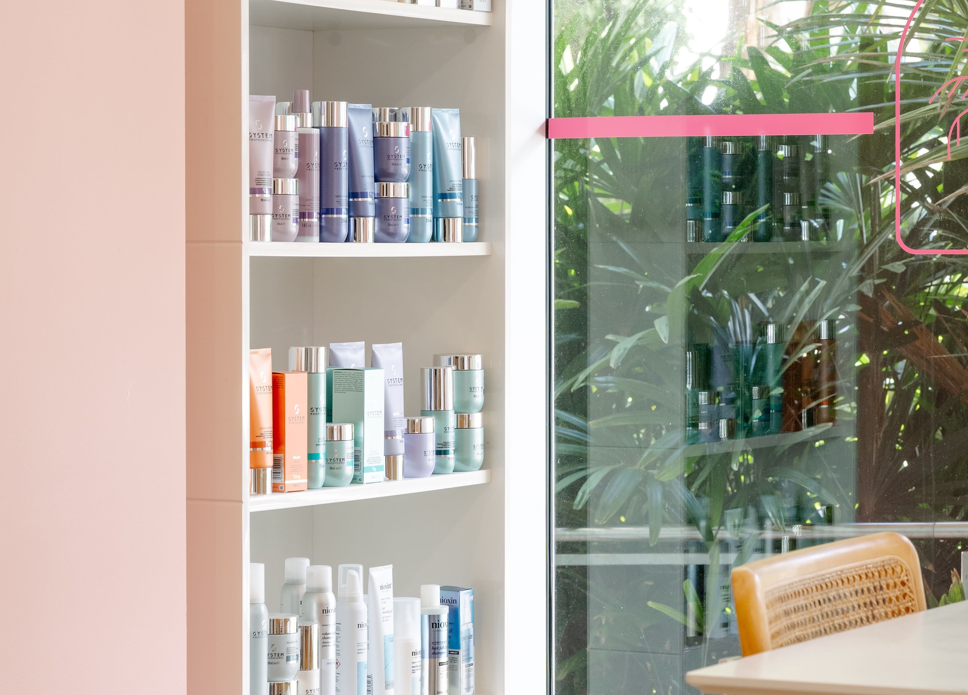 Product display at Blondelicious, Palm Cove, Queensland, AU with lush greenery backdrop.