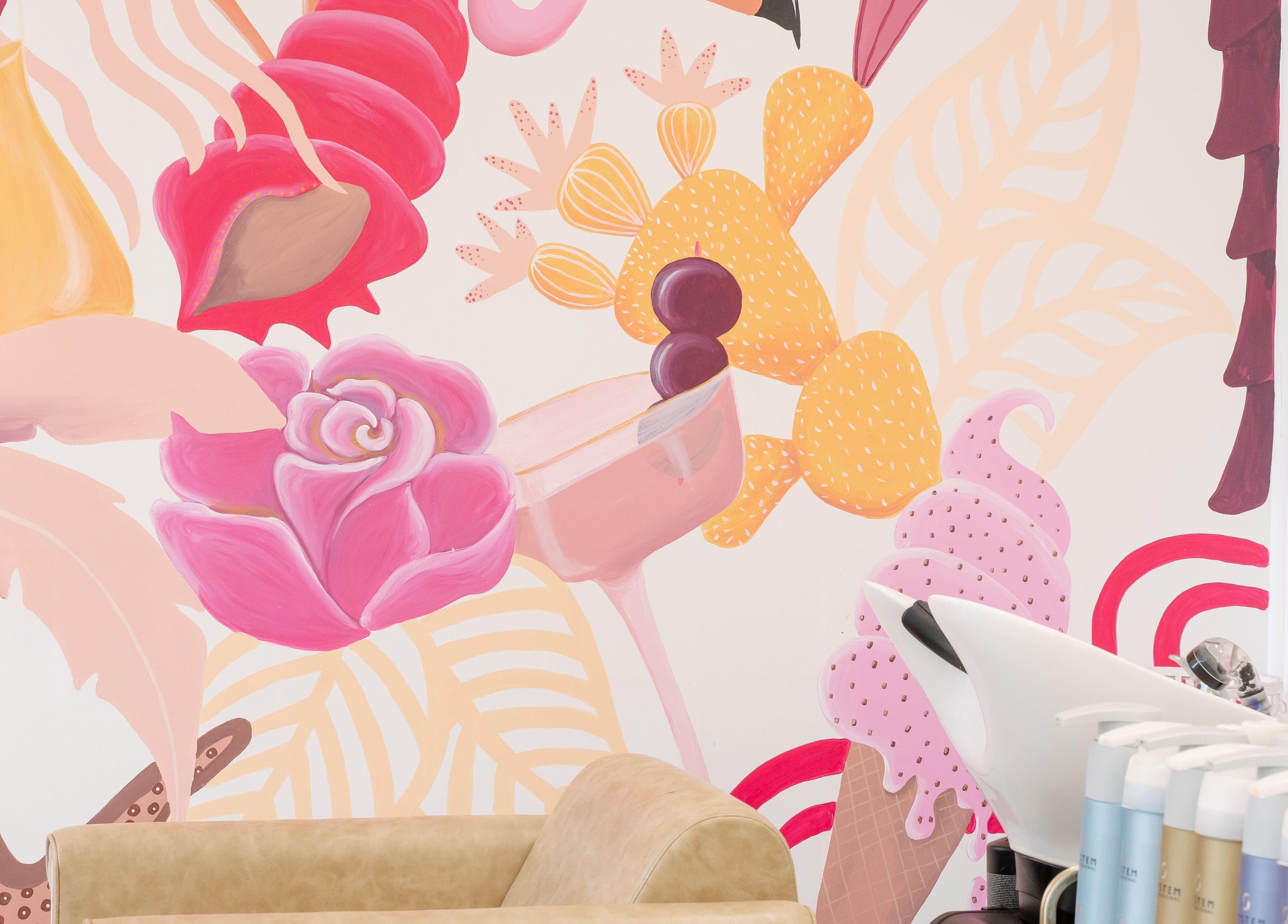 Colorful mural at Blondelicious, Palm Cove, Queensland, AU, enhancing the salon's lively ambiance.