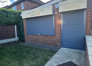 Front exterior of Laser Lab Yorkshire, beauty venue in Normanton, England, GB with closed shopfront.