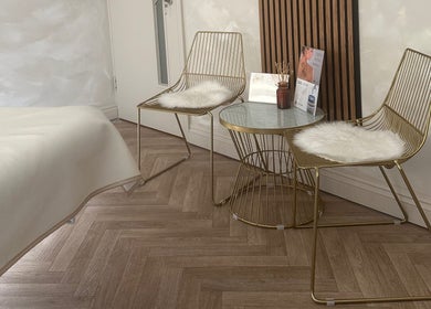 Elegant seating area at Laser Lab Yorkshire, Normanton, England, GB with stylish chairs and table.
