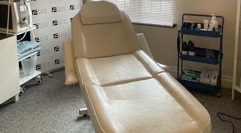 Luxurious treatment room at Flux Skin (Droitwich) in Droitwich Spa, England, GB featuring a modern spa chair.