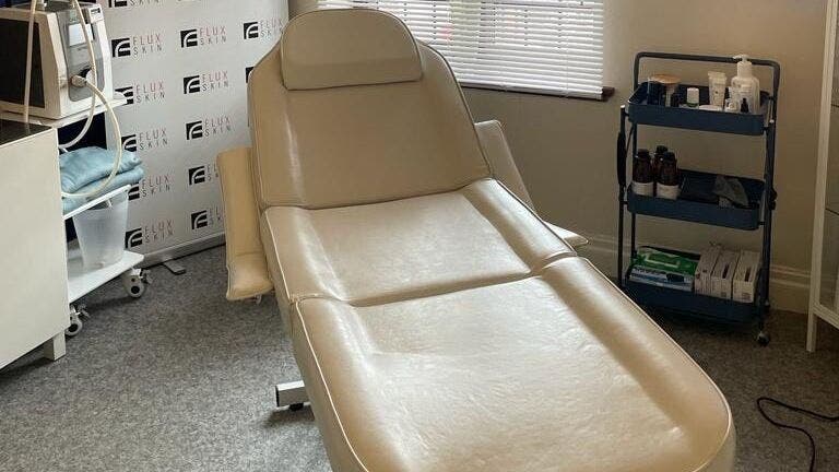 Luxurious treatment room at Flux Skin (Droitwich) in Droitwich Spa, England, GB featuring a modern spa chair.