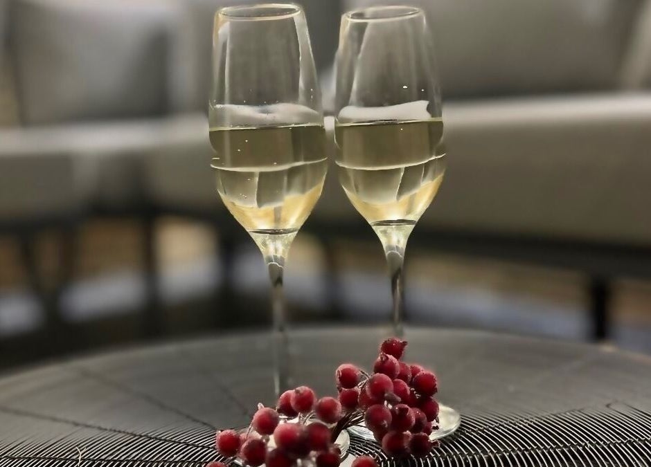 Champagne glasses and berries at Mirror Mirror Shrewsbury, Shrewsbury, GB, set for a relaxing ambiance.