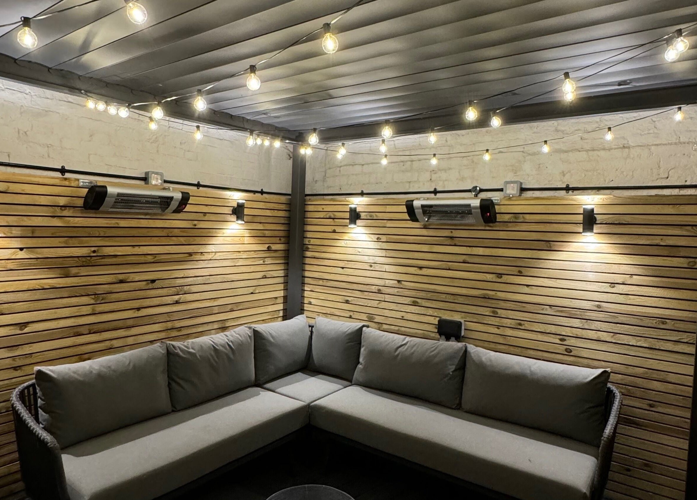 Warm lit corner with cozy seating at Mirror Mirror Shrewsbury, Shrewsbury, GB showcasing ambient atmosphere.