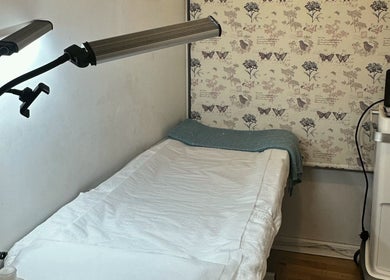 Cozy treatment room at Beautiful You By Lina, Mitcham, England, GB, featuring a comfortable bed and soft lighting.