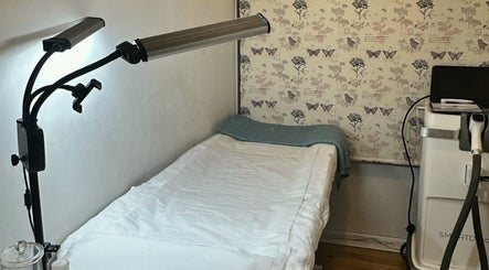 Cozy treatment room at Beautiful You By Lina, Mitcham, England, GB, featuring a comfortable bed and soft lighting.