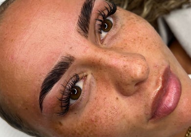 Close-up of a woman's groomed eyebrows and lashes at RH Cosmetics in Leeds, England, GB.