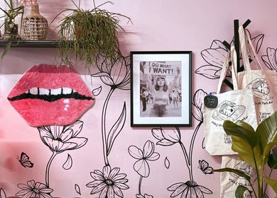 Stylish pink wall with art and plants at Tattoo Like a Girl Club, Dublin, County Dublin, IE.