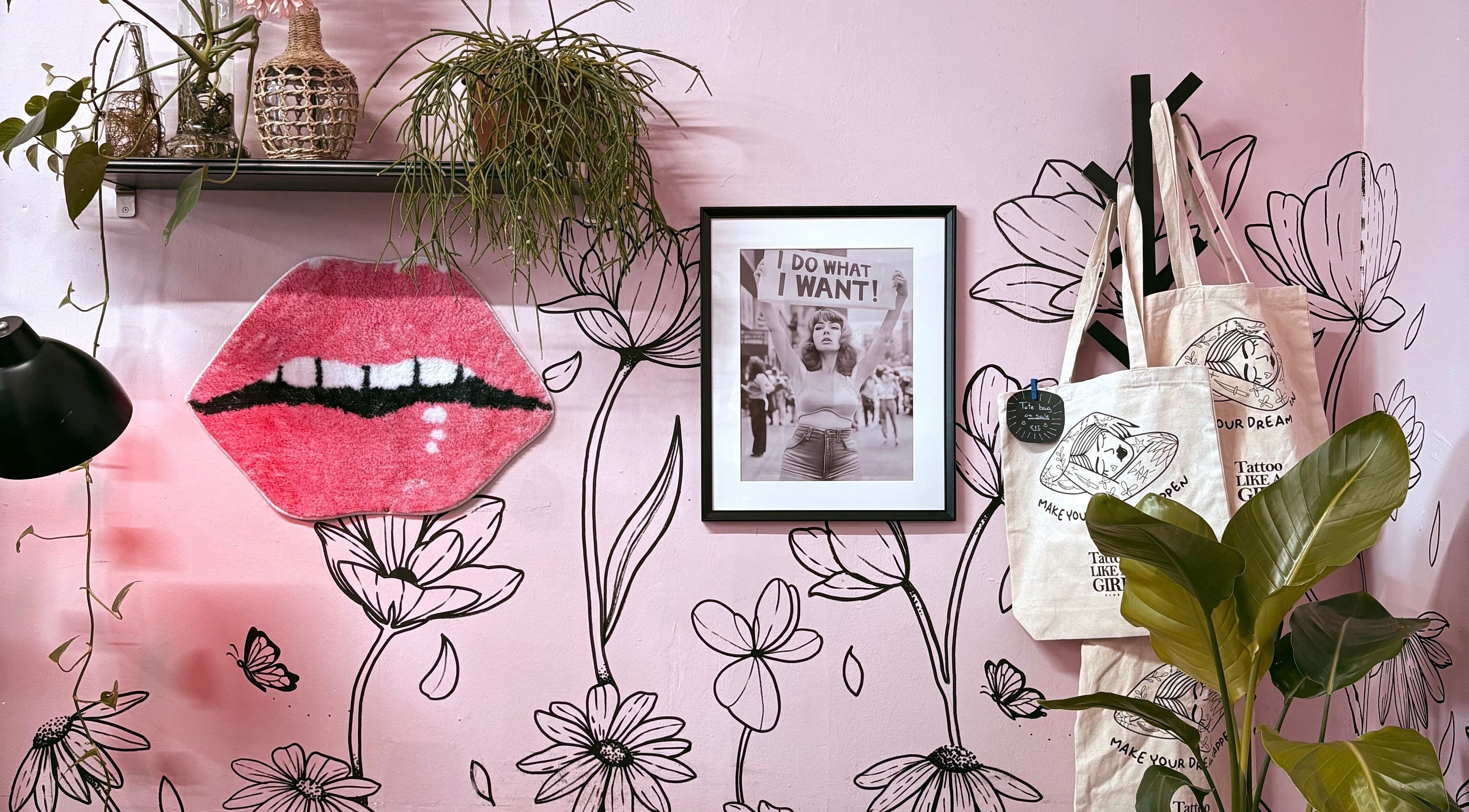 Stylish pink wall with art and plants at Tattoo Like a Girl Club, Dublin, County Dublin, IE.