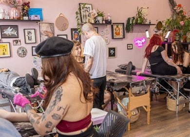 Artists tattooing at Tattoo Like a Girl Club, a vibrant studio in Dublin, County Dublin, IE.