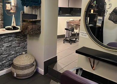 Modern salon interior at Beau Beauty And Skincare Specialist in Sutterton, England, GB, featuring seating and decor.