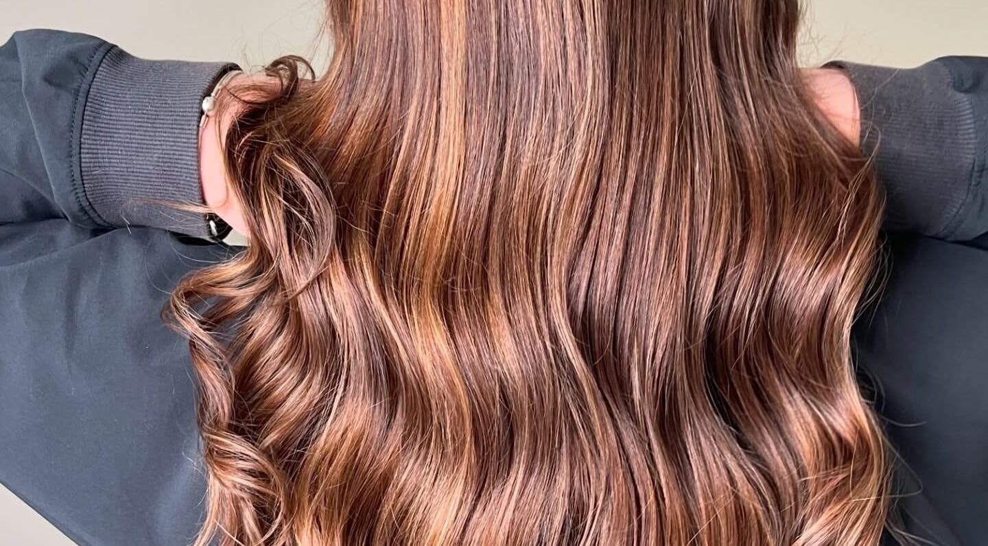 Shiny, wavy brown hair professionally styled at Shekinah Studios Ltd, Manukau, Auckland, NZ.