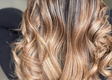 Stunning wavy golden hairstyle at Shekinah Studios Ltd, Manukau, Auckland, NZ. Perfect for an elegant look.