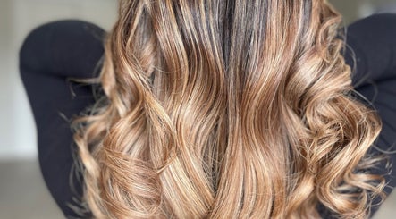 Stunning wavy golden hairstyle at Shekinah Studios Ltd, Manukau, Auckland, NZ. Perfect for an elegant look.