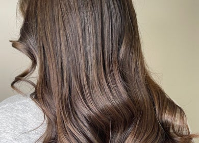 Smooth brunette hair styled in soft curls at Shekinah Studios Ltd, Manukau, Auckland, NZ.