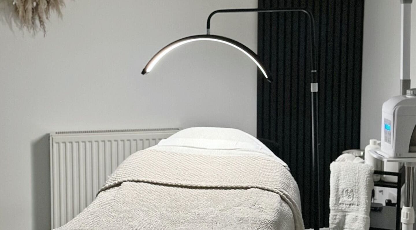 Cozy treatment room at SKN By Sonia in Burton Upon Trent, England, GB with modern lighting and soft linens.