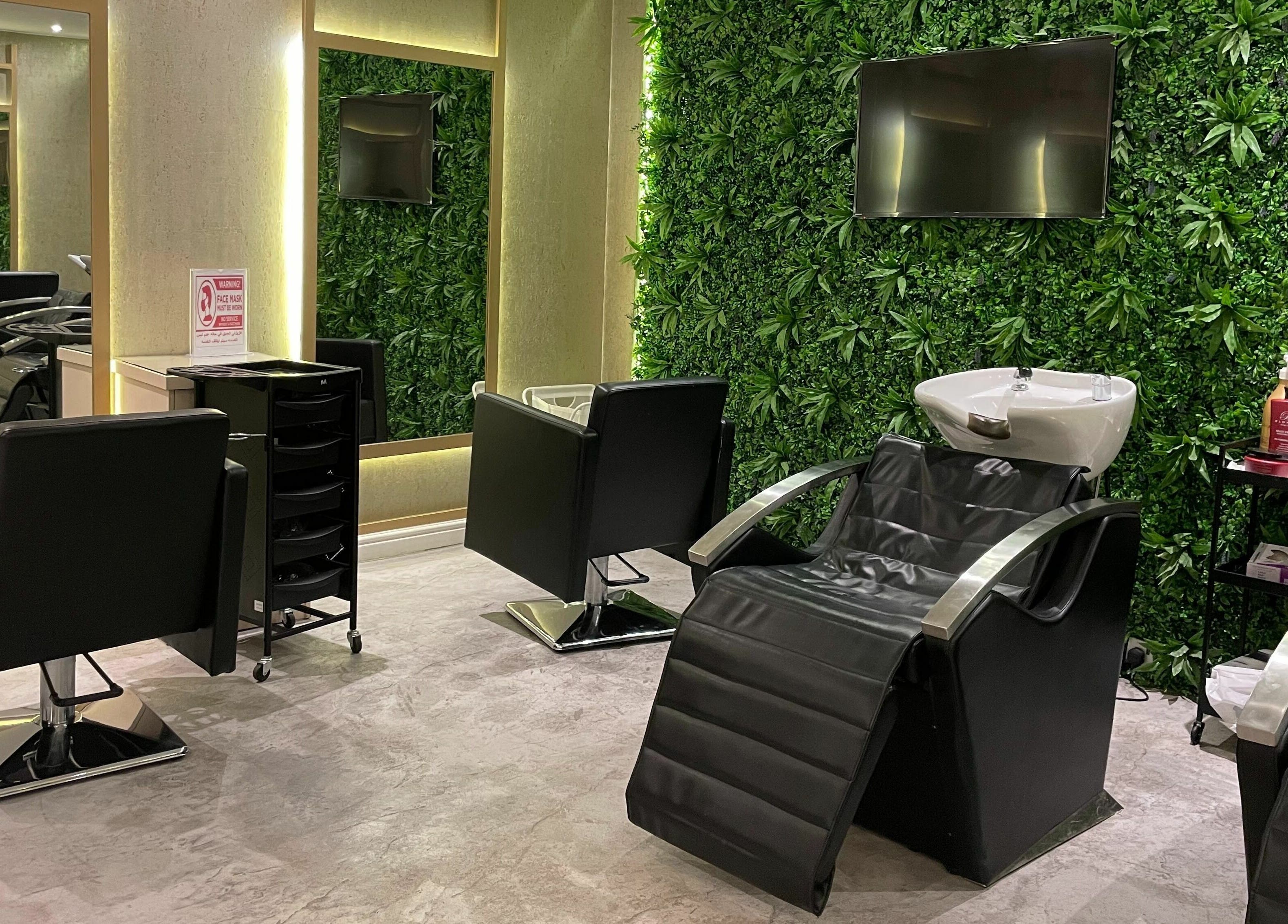 Luxurious salon chairs at Zoz Lashes - Riyadh, Riyadh Province, SA, featuring lush greenery walls.