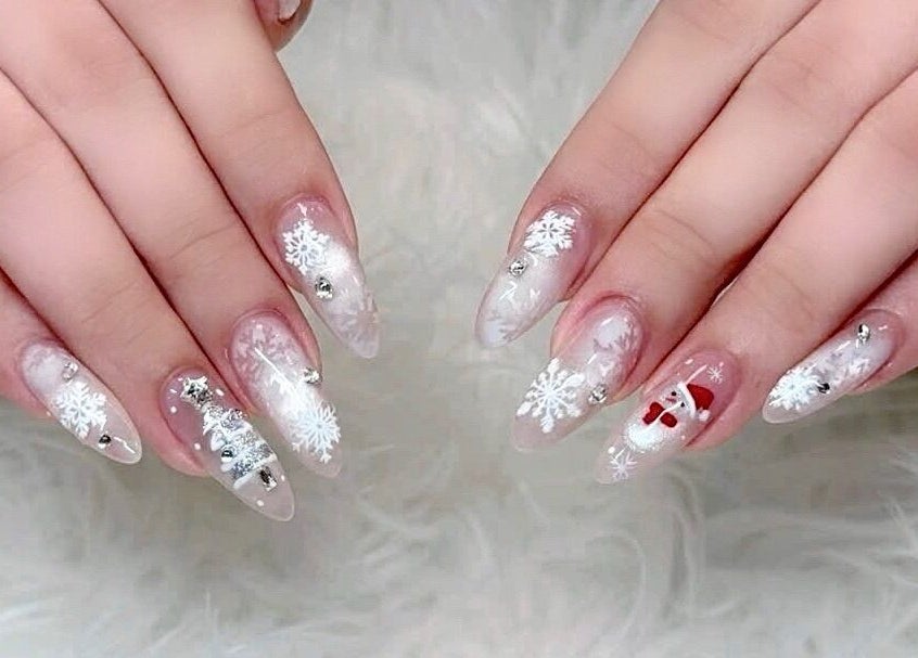 Festive snowflake nail art at Beauticure Nails, Toronto, Ontario, CA.