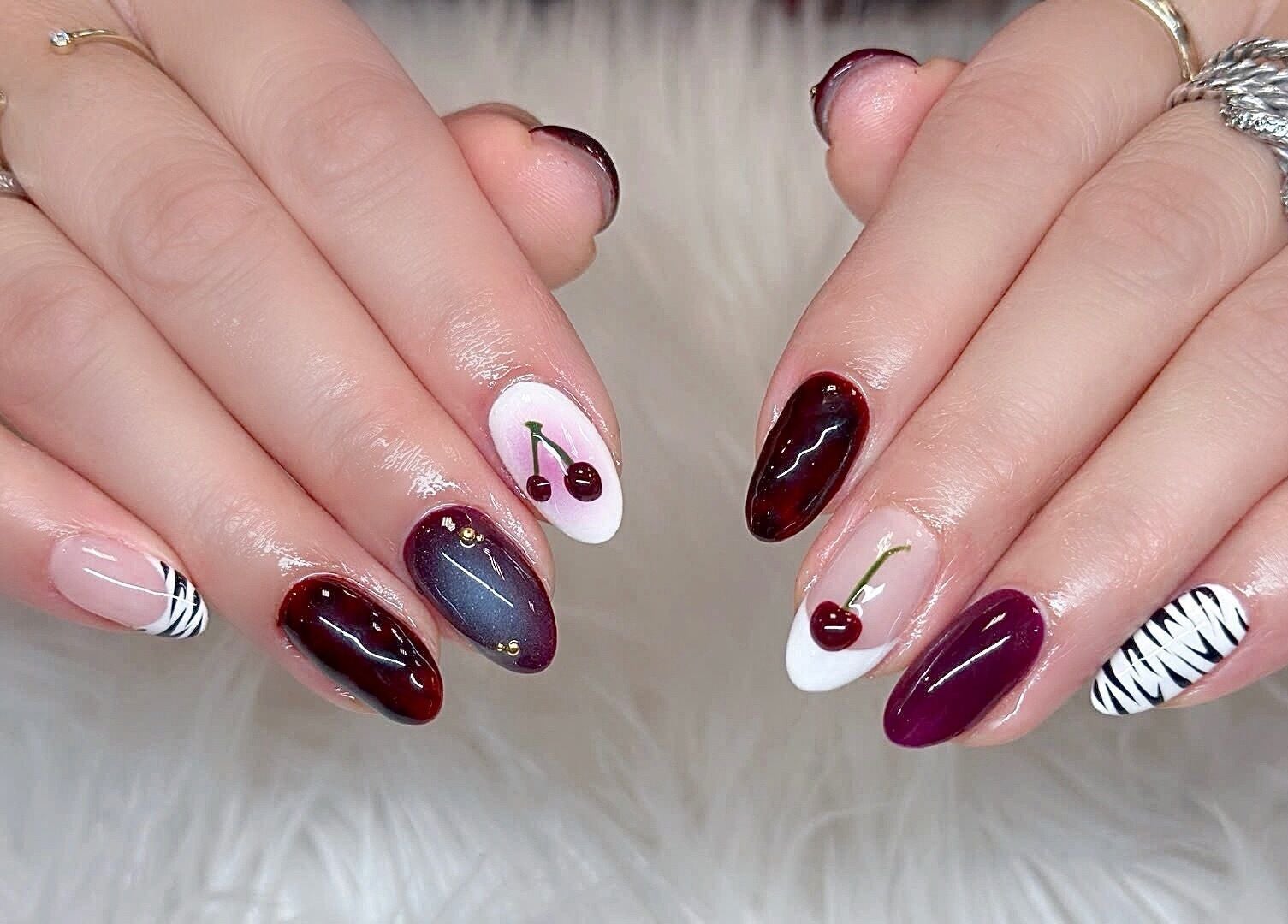 Elegant cherry and zebra nail art at Beauticure Nails, Toronto, Ontario, CA.