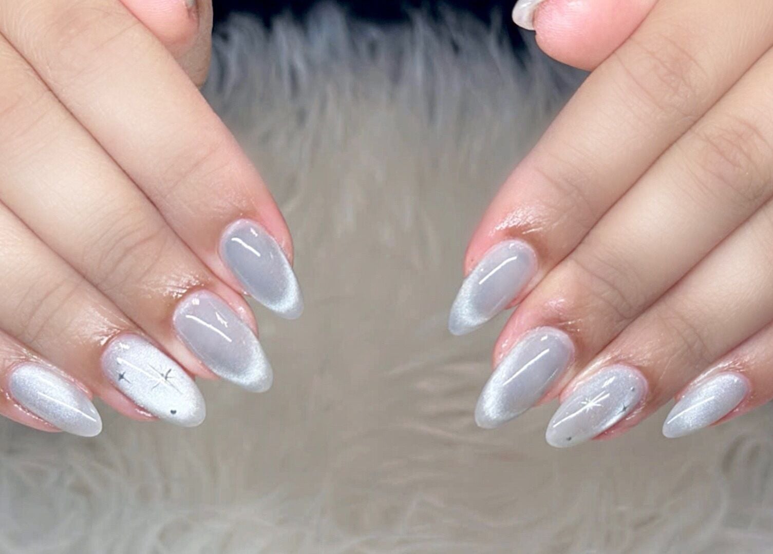 Elegant starry silver nails at Beauticure Nails, Toronto, Ontario, CA, showcasing nail art finesse.