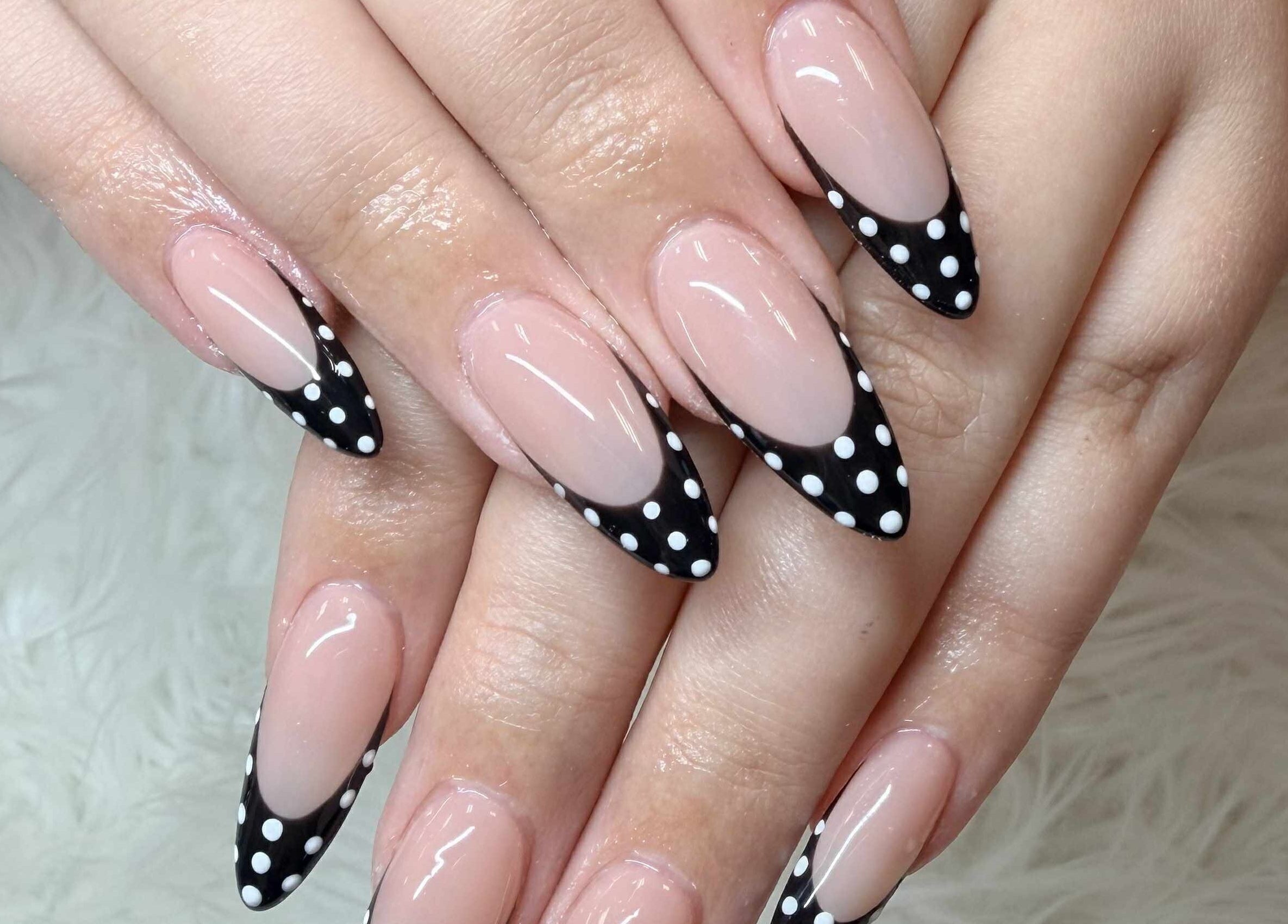 Polka dot nail design at Beauticure Nails, Toronto, Ontario, CA showcases chic style.