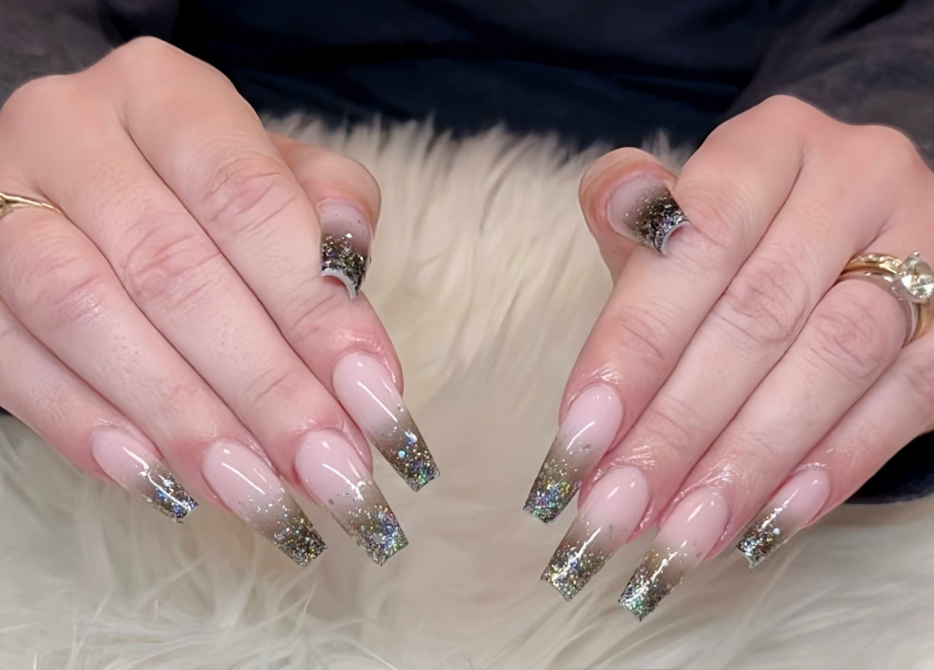 Sparkling nail art at Beauticure Nails in Toronto, Ontario, CA showcasing elegant glitter designs.