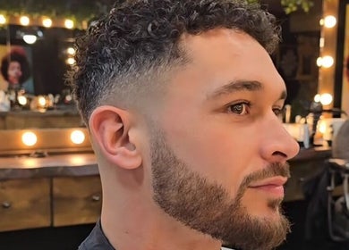 Modern haircut at Fade Masters Barbers & Tanning Salon Hale, Hale Barns, England, GB showcasing stylish grooming.
