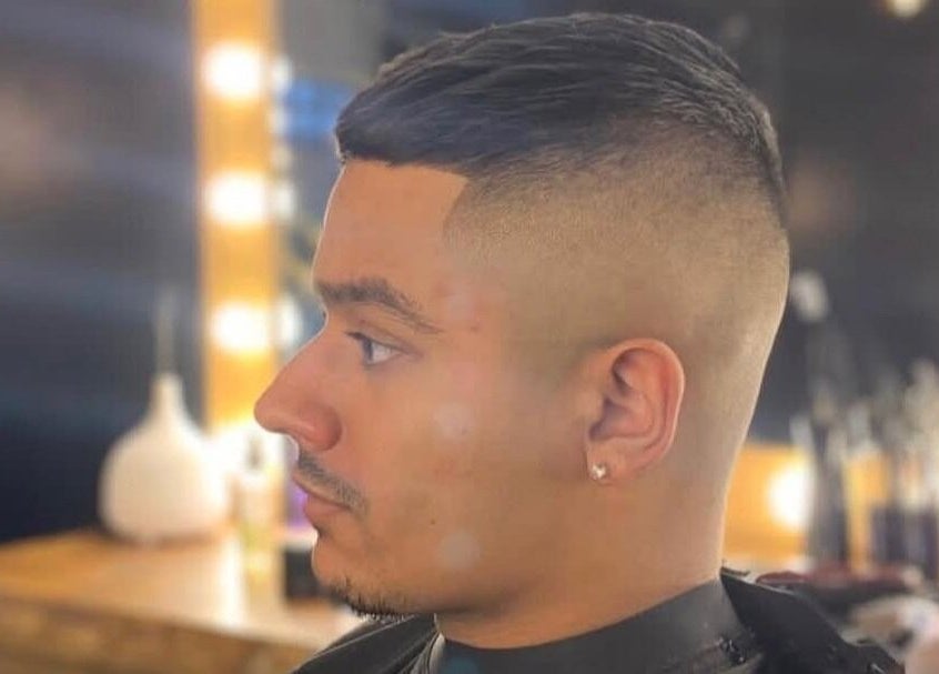 Crisp haircut at Fade Masters Barbers & Tanning Salon Hale, Hale Barns, England, GB. Stylish grooming displayed.