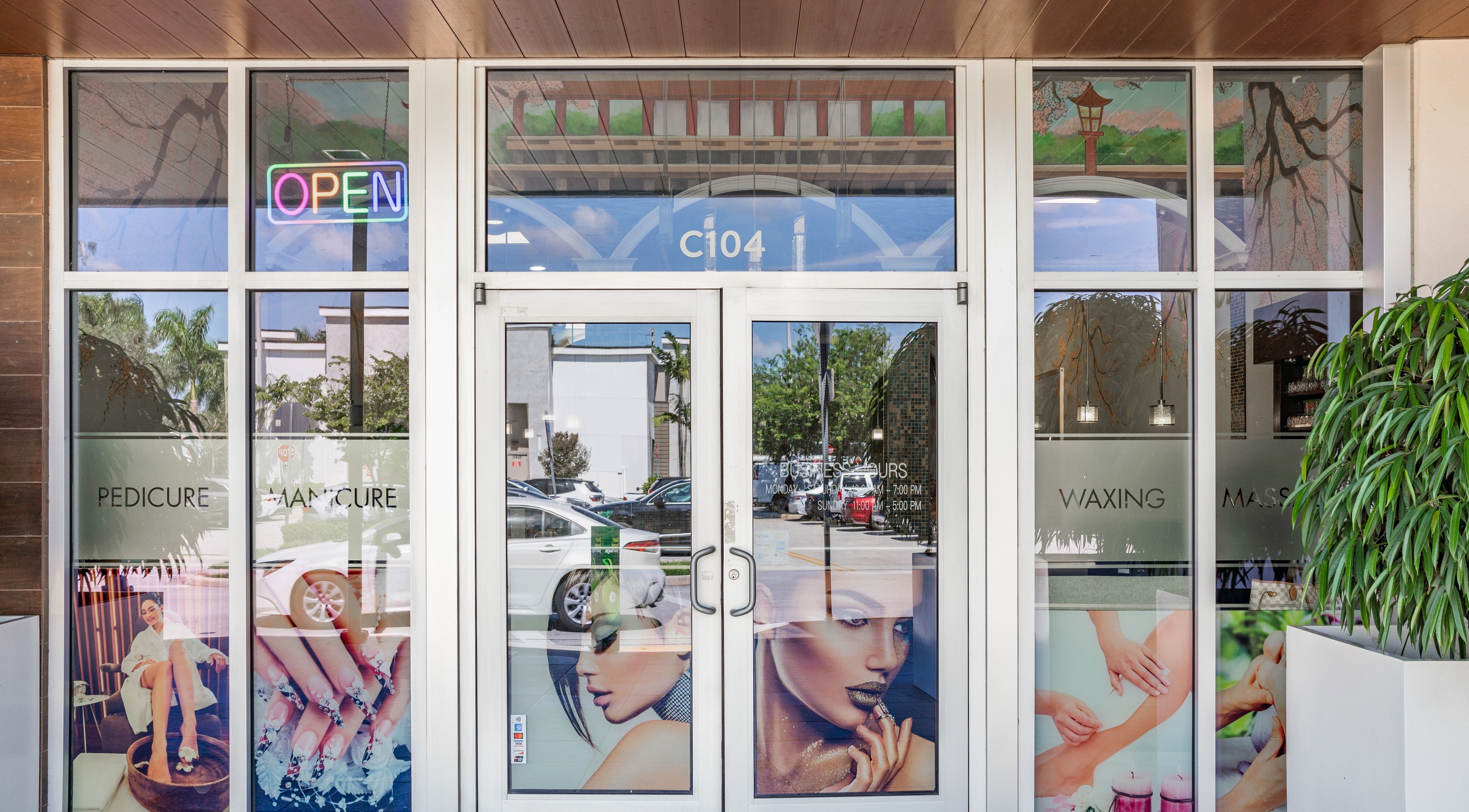 Front entrance of Angelic Nails Spa in Pembroke Pines, Florida, US, featuring vibrant nail art displays.