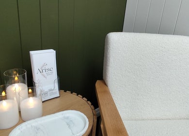 Relaxing seating area with candles at Arise Skin and Beauty, Palmerston North, Manawatū-whanganui Region, NZ.