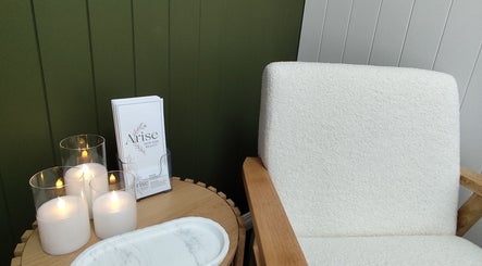 Relaxing seating area with candles at Arise Skin and Beauty, Palmerston North, Manawatū-whanganui Region, NZ.