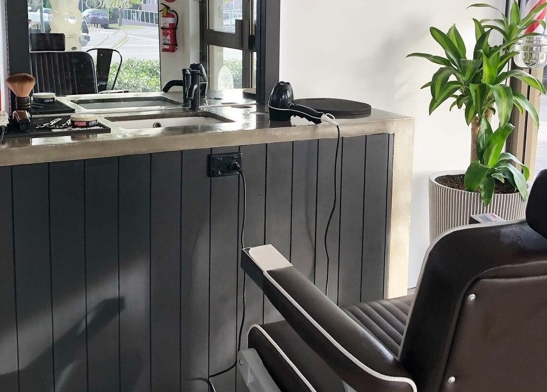 Sleek barber station at Barber Theory, Nowra, New South Wales, AU featuring a modern chair and grooming tools.