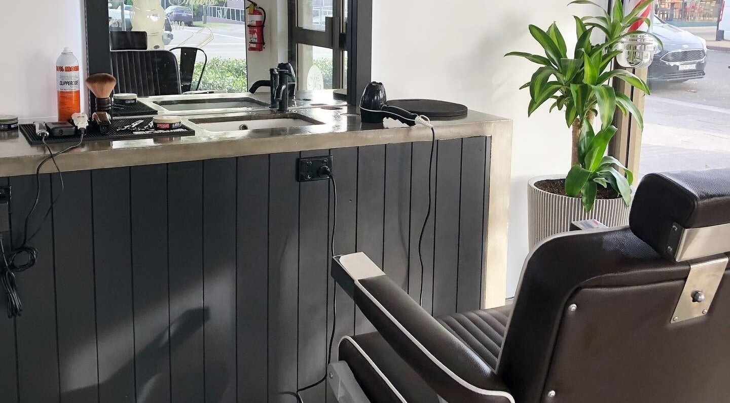 Sleek barber station at Barber Theory, Nowra, New South Wales, AU featuring a modern chair and grooming tools.