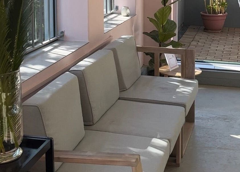 Relaxing lounge area at Lash and Dash in Sandton, Gauteng, ZA with modern seating and greenery.