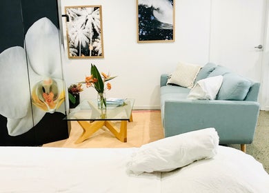 Relaxing lounge setting at The Sanctuary, Kingscliff in Kingscliff, New South Wales, AU with a chic orchid decor.