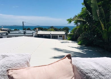 Relaxing view of ocean from The Sanctuary, Kingscliff, Kingscliff, New South Wales, AU with tropical greenery.