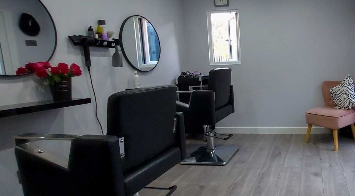 Stylish salon setup at Alchemy - Magical Hair Creation in Eastbourne, England, GB with chairs and mirrors.
