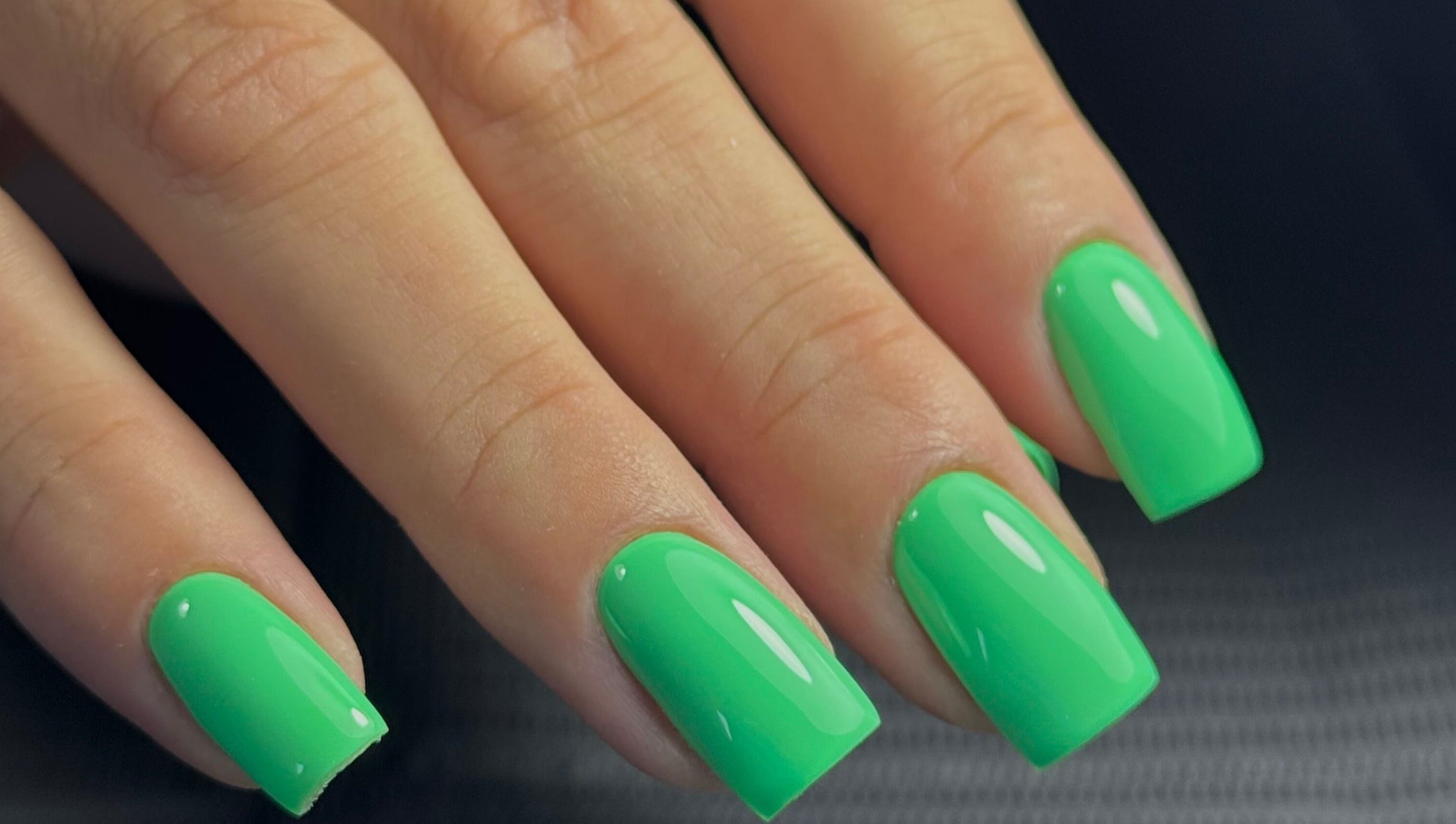 Vibrant green nails at Funkd Up Nails in Montréal, Québec, CA offer a sleek and trendy design.