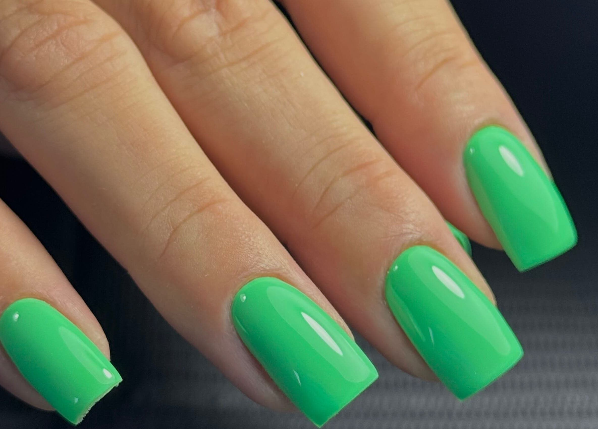 Vibrant green nails at Funkd Up Nails in Montréal, Québec, CA offer a sleek and trendy design.