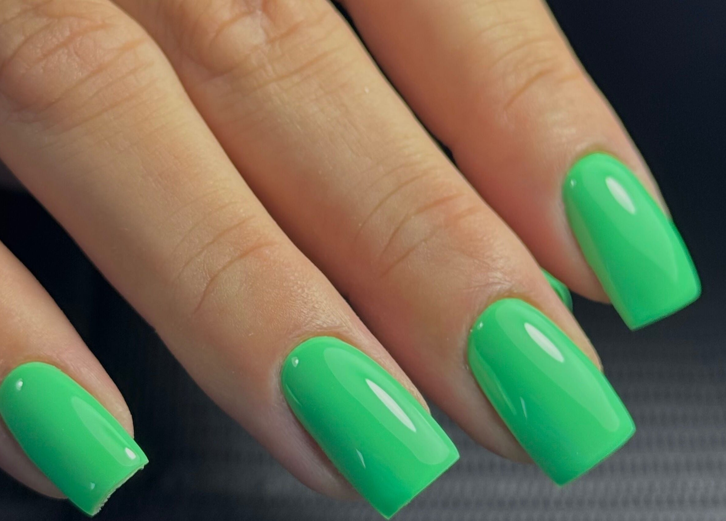 Vibrant green nails at Funkd Up Nails in Montréal, Québec, CA offer a sleek and trendy design.
