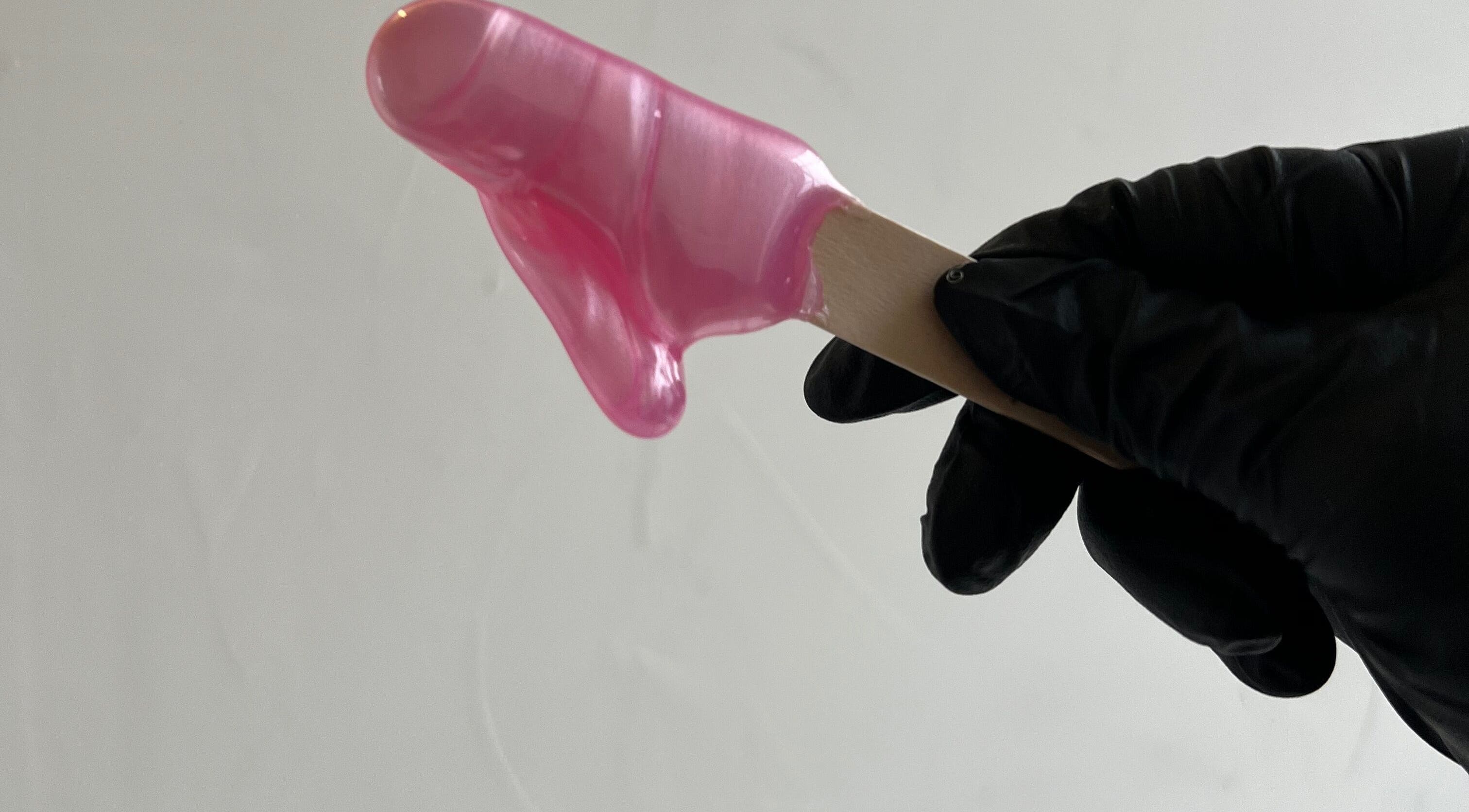 Pink gel being applied with precision at Funkd Up Nails in Montréal, Québec, CA.