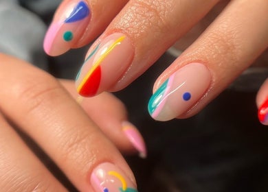 Colorful abstract nail art at Funkd Up Nails, Montréal, Québec, CA. A vibrant display of creative nail designs.