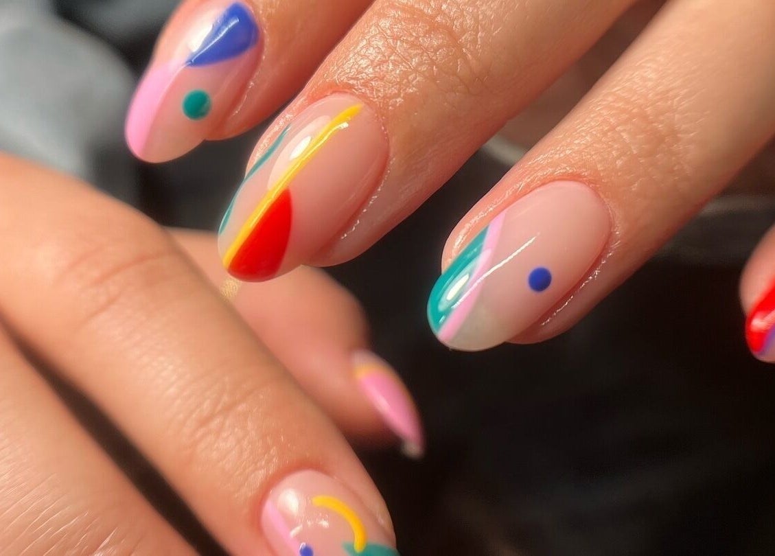 Colorful abstract nail art at Funkd Up Nails, Montréal, Québec, CA. A vibrant display of creative nail designs.