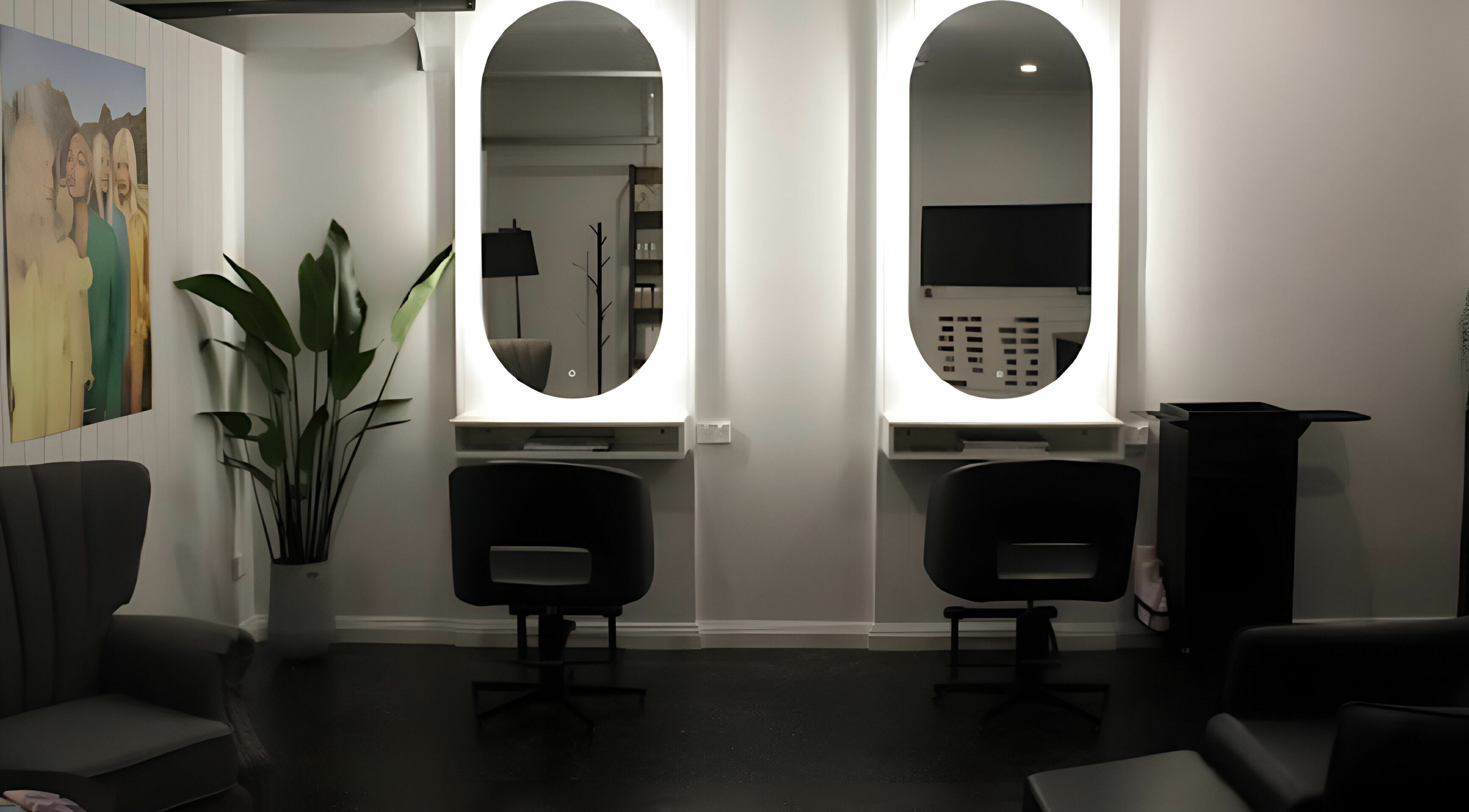 Modern salon interior at Hannah Ashley Hair, Warrnambool, Victoria, AU with stylish mirrors and chairs.