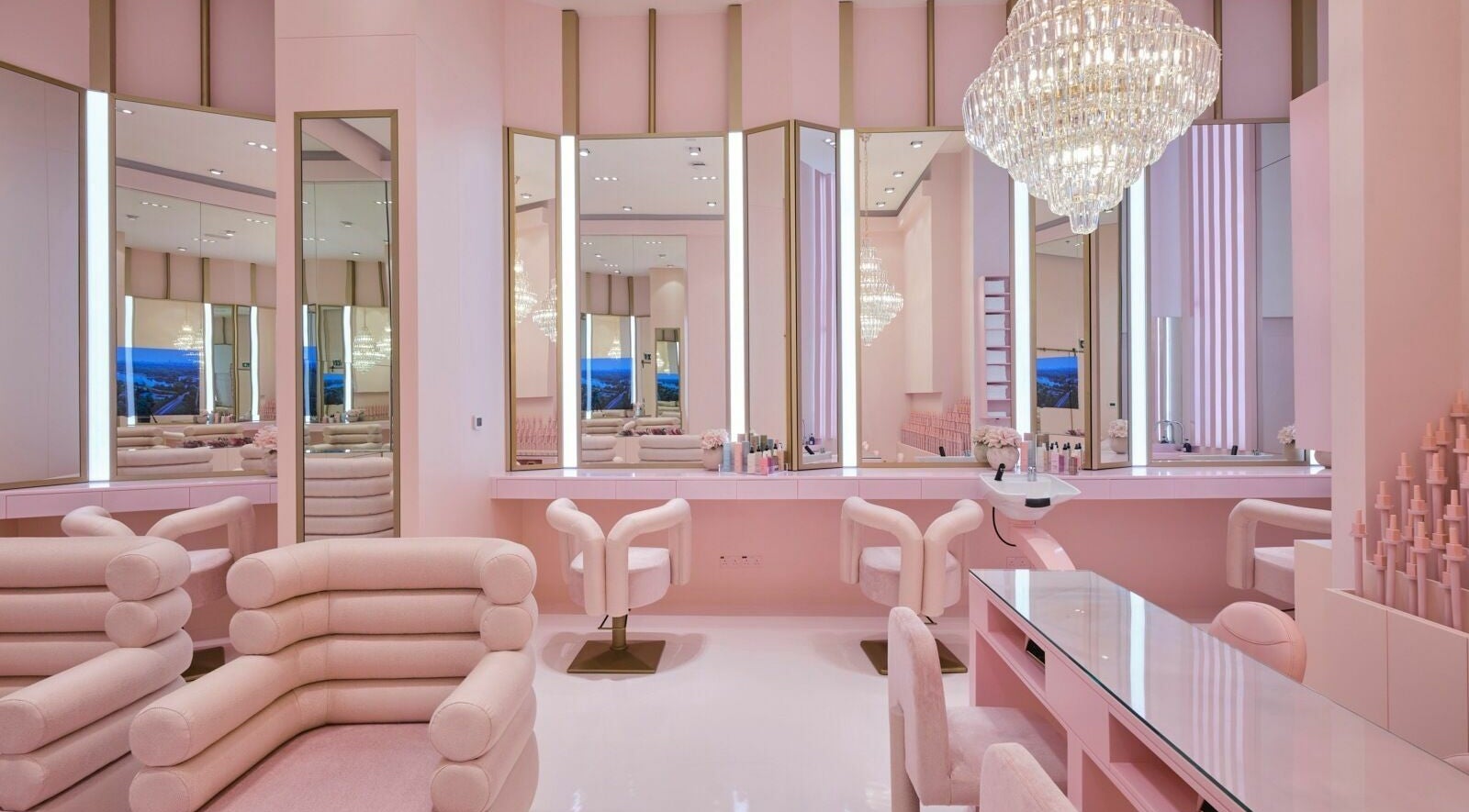 Luxurious pink interior of Nail'd it Dubai Mall, Dubai, Dubai, AE featuring chic salon chairs and mirrors.