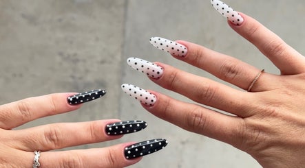 Polka dot nail design at Nails by Natasha, Dorval, Quebec, CA. Black and white elegance.
