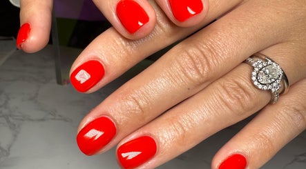 Vibrant red manicure by Nails by Natasha, Dorval, Quebec, CA, showcasing elegant nail art.