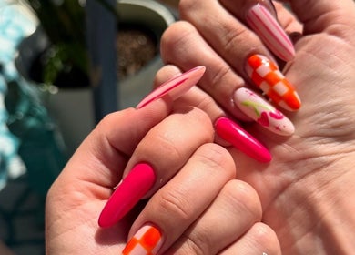 Colorful nail designs at Nails by Natasha, Dorval, Quebec, CA, showcasing creative artistry.