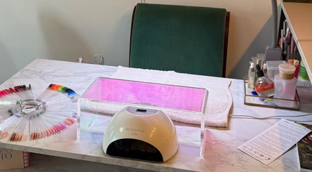 Bright nail art station at Nails By Natasha, Dorval, Quebec, CA, showcasing vibrant polish options.