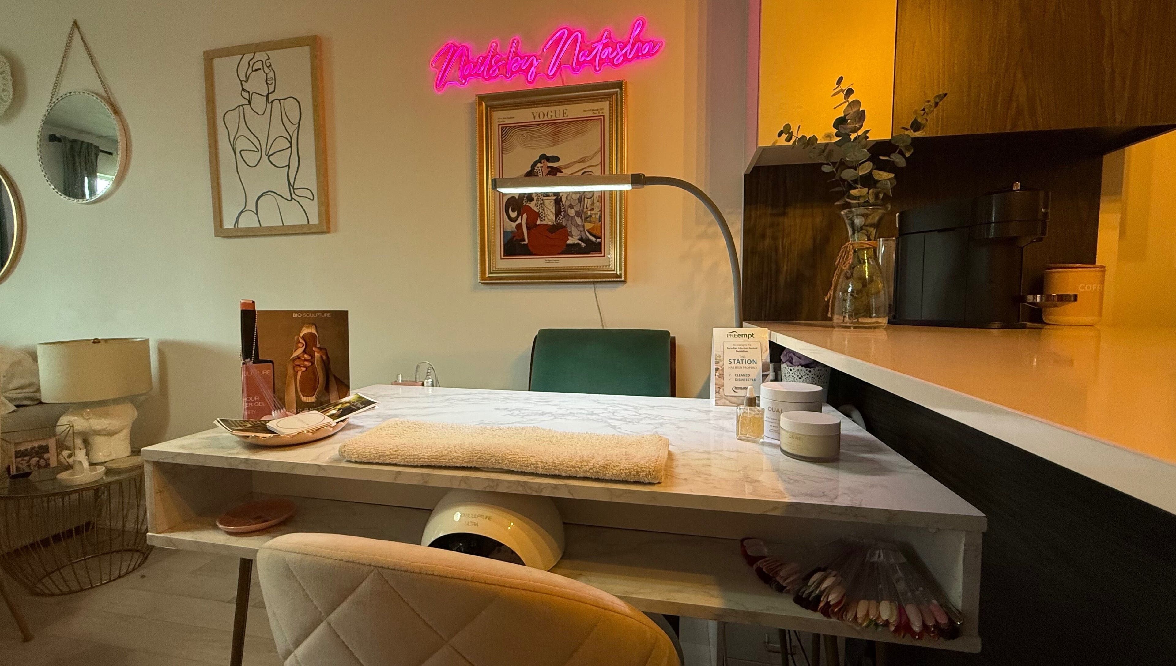 Cozy nail station at Nails By Natasha in Dorval, Quebec, CA with elegant decor and ambient lighting.
